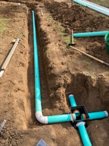 Constructing septic lines with distribution box in a dirt trench