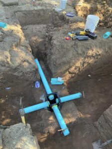 Constructing a new septic system with leach field lines and distribution box
