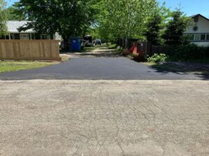 Street view in chico, ca of asphalt approach and gravel driveway