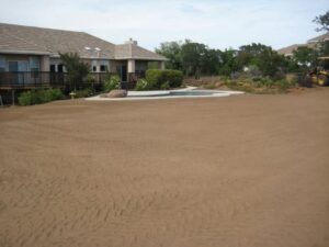 Leveled and graded backyard of house in chico, ca with swimming pool