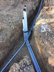 Site work trench with underground utility installation